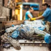 plastic-garbage-conveyor-belt-waste-recycling-factory-workers-background